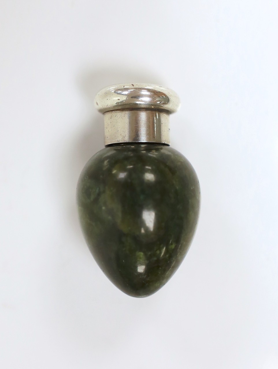 A late Victorian silver mounted green hardstone pear shaped scent bottle, by Sampson Mordan & Co, London, 1890, 5cm.